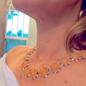 Necklace. peach stone set in gold metal and rhinestones